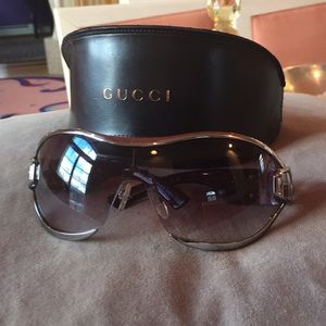 Gucci women’s buckle sunglasses
